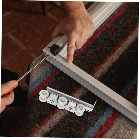 Premium Heavy Duty Barn Door Slider Track Wheel Kit With Smooth Silent Rolling Bearings during installation with tools.