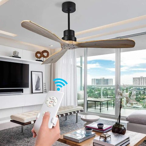 Person using 3 In 1 Ceiling Fan Remote Control Kit With Light, Timing And Speed, Wireless Receiver in a modern living room.