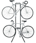 Rugged Two Bike Gravity Rack For Garage And Home No Drilling Required Fully Adjustable Leaning Wall Space Saver Bike Storage Stand Holds Up To 100 Lbs showing two bikes mounted