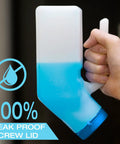 Person holding Glow In The Dark Urinal For Men With Spill Proof Screw On Lid 32oz Thick Plastic Pee Bottle Bedpan Style Urine Container