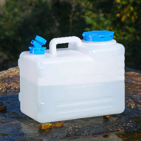 4 Gallon Camping Water Jug With Spigot For Emergency Water Storage Outdoors on rock, detachable spigot, blue cap.