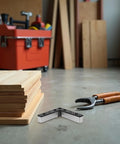 Workshop view with tools and plank, highlighting Four Pack L Shaped Aluminum Furniture Legs With Plastic And Alloy Replacement Sofa.