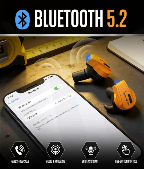 Bluetooth 5.2 headphones next to smartphone displaying connectivity, placed on a table with measuring tape and notebook.