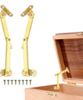 Pack Of Two Heavy Duty Brass Lift Hinges With Smooth Swing Lid Supports For Cabinet Wardrobe And Jewelry Box Features A Sweet Gold Tone Finish installed with screws and wooden box.