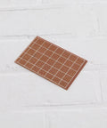 Ten Pack Single Sided Prototyping PCBs 64Mm By 95Mm 1.4Mm Thick Bakelite Circuit Boards for DIY Soldering Projects on white surface