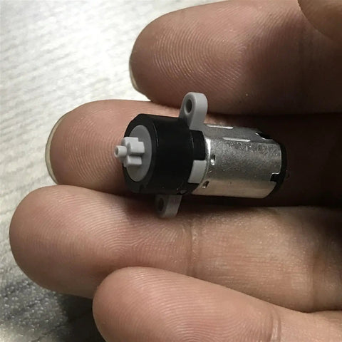 Hand holding DC Planetary Gear Motor Dope Compact 3V 5V 6V 120RPM High Torque 8mm By 10mm Shaft M10 Reducer For Robot DIY Toy