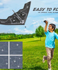 Boy flying B-2 Spirit Stealth Bomber RC Airplane Ready To Fly 2.4GHz 2CH Foam Drone For Kids And Adults, black color.