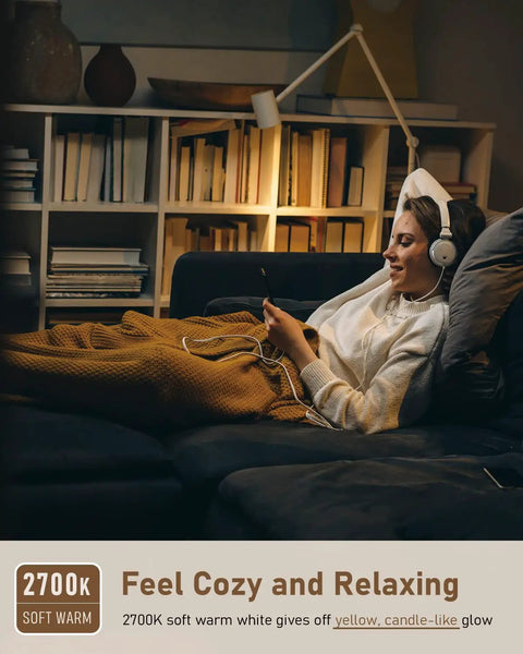 Person relaxing on sofa, warm 2700K lighting from E12 LED Candelabra Bulbs Dimmable, 40 Watt Equal, ideal for cozy settings