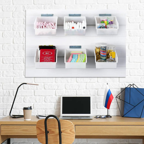 Office view of Six Pack Slatwall Bins With Hooks Set For Wall Mounted Storage holding office supplies against a brick wall.