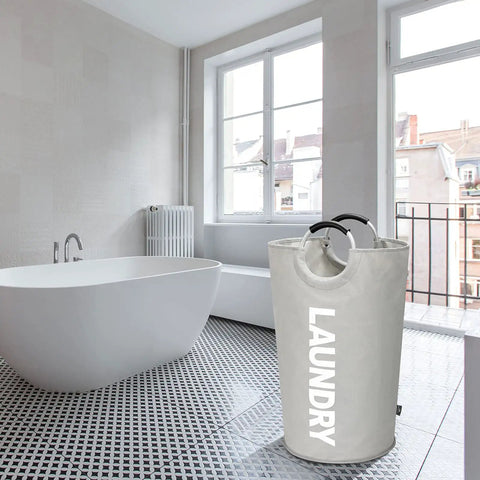 115L XXL Collapsible Laundry Hamper With Aluminum Soft Grip Handle in a modern bathroom setting