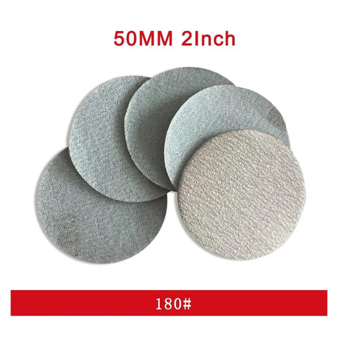 Get 300 Pcs Of Pro Grade 2 Inch Round White Hook And Loop Sanding Discs With Peel Switch Backing For Effortless Tool Free Swapping Plus Dust Venting Holes To Keep Your Work Area Clean While You Crush It Like A Boss - 180 grit sanding discs in various textures.
