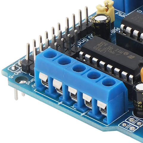 Close-up of 4 Way L293D DC Motor Driver Shield for Arduino and Raspberry Pi showing ports and pins.