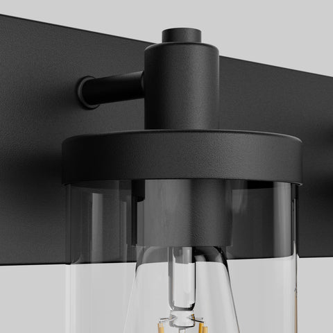 Close-up of Farmhouse Four Light Matte Black Vanity Light Fixture showcasing aluminum construction and clear glass shade detail.