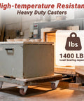 3 Inch Heavy Duty Casters Wheels Set Of Four With Brakes 1400 Pounds Capacity Glass Filled Nylon Heat Resistant To 475 Fahrenheit Industrial Castors For Workbench High Temperature Casters For Heavy Equipment And Mobility supporting a large metal box in a workshop.
