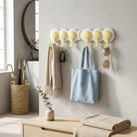 Heavy Duty Six Hook Adhesive Wall Rack With Smooth 180 Degree Swivel And Easy No Drill Mount holding a scarf, bag, and sunglasses.