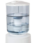 White GWF8 Water Filtration System For Top Load Dispensers with transparent tank showing filter inside