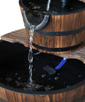 Close-up of Go-To Wood Freestanding Two Tier Waterfall Barrel Fountain With Electric Pump For Garden Decor, water flowing.