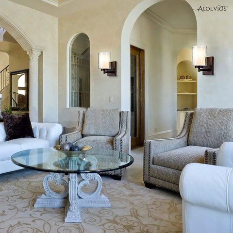 Stylish living room with pair of farmhouse style oil rubbed bronze wall sconces with seeded glass shades, vintage modern ambiance.