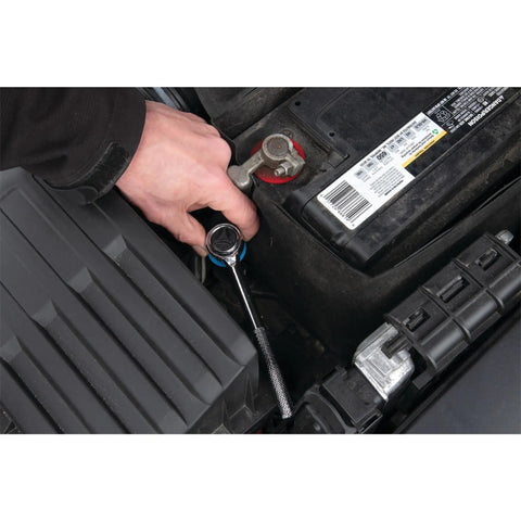 Mechanic using 85 Piece SAE And Metric Socket Set With One Quarter Inch, Three Eighths Inch And One Half Inch Drives on car engine