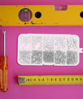 320 Piece Zinc Alloy Pan Head Screw Nuts And Washers Kit For Quick Install And Tight Secure Connections With Tools On Pink Background