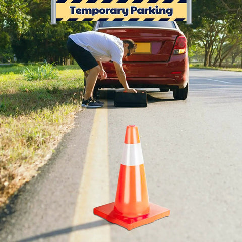 18 Inch Traffic Safety Cones 12 Pack Orange PVC With Reflective Collars Built For Parking Lot Traffic Control Driveway And Construction Sites Tough As Nails Heavy Duty Stable 11 By 11 Inch Base placed on roadside with car