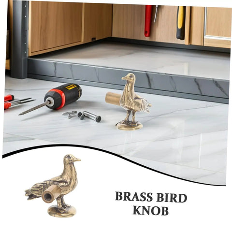 Brass Dove Cabinet Pulls Set Two Pack on marble surface with DIY tools nearby