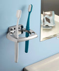 Chrome toothbrush holder with two brushes on bathroom wall, near Donnor Collection Chrome Wall Mount Hand Towel Ring 6.25 Inch Diameter.