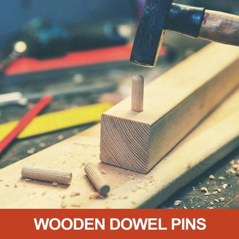 Wood Dowel Pins 3/8 Inch By 4 Inch Straight Fluted Dowels being hammered into wood block