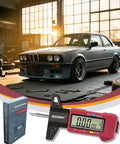 Digital Tire Tread Depth Gauge With Three Modes And Color Coded Scale next to a car in a garage with box packaging