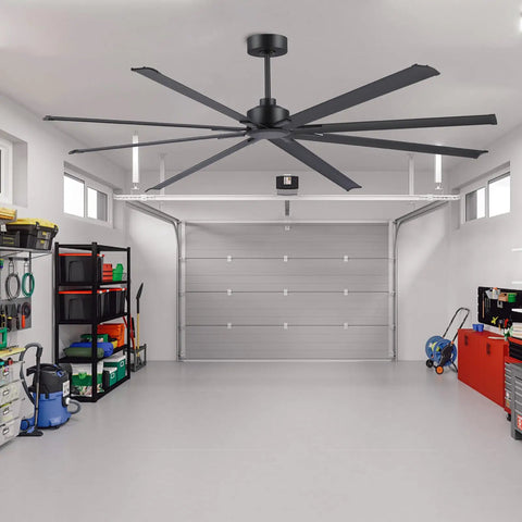 Badass 84 Inch Industrial Ceiling Fan With Reversible DC Motor And Eight Robust Blades Delivers Six Speed Remote Control Hella Quiet Airflow For Massive Garages And Shops In Matte Black in a spacious garage.