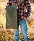 Person holding Beefy Warmth And Rugged Durability Military Wool Blanket For Outdoors Camping Picnics Travel Stadium Events And Survival Kits