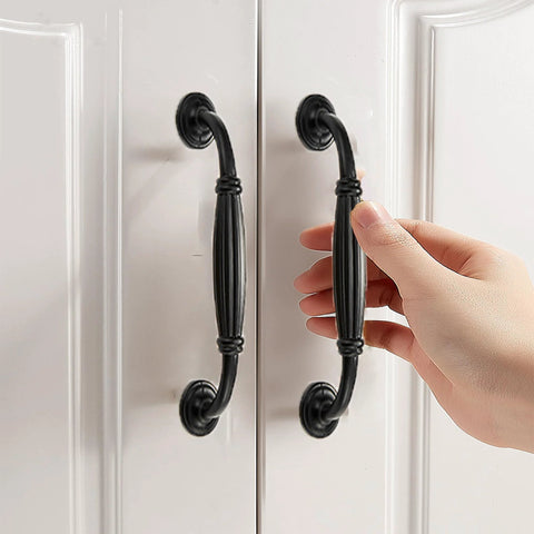 Matte Black Aluminum Alloy 10-Piece Drawer Handles Set For Kitchen Cabinets And Drawers, antique style pulls installed on white doors.