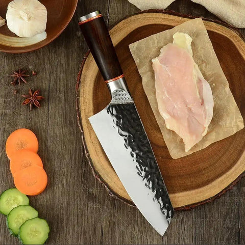 Beast Mode 7 Inch Meat Cleaver For Kitchen Prep with 5Cr15Mov steel blade on wooden board with sliced vegetables and garlic