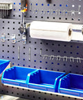 Rock Solid And Built Tough 80 Piece Peg Board Hooks And Bins Set For Garage Tool Storage Wall Mount Organizer With Steel Pegs on wall.