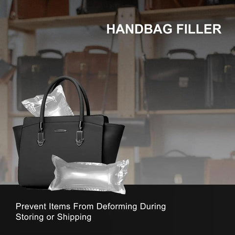 Black handbag with inflatable air pillows for shaping, displayed on shelf with other handbags in store setting.
