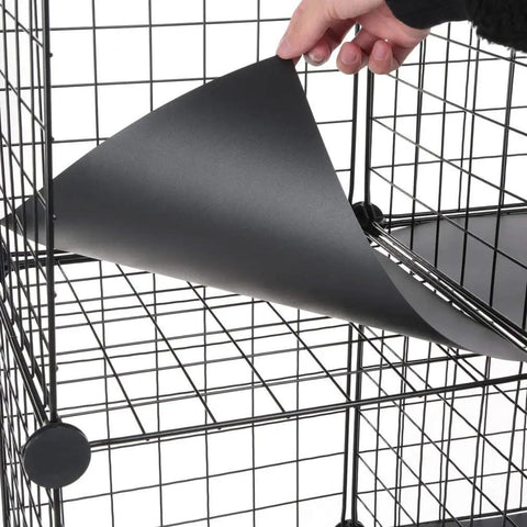 Hand inserting shelf liner into Six Cube Wire Storage Organizer Shelf For Books Toys Clothes And Tools, 12 Inch By 12 Inch By 12 Inch DIY Cube Shelf