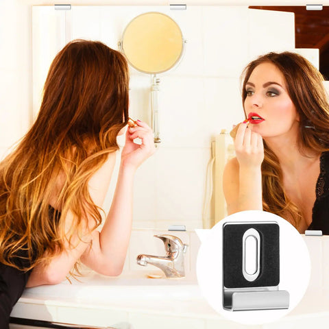 A woman applying lipstick in front of a bathroom mirror showcasing Tough Built Metal Mirror Holder Kit J Type Hanger Clips.