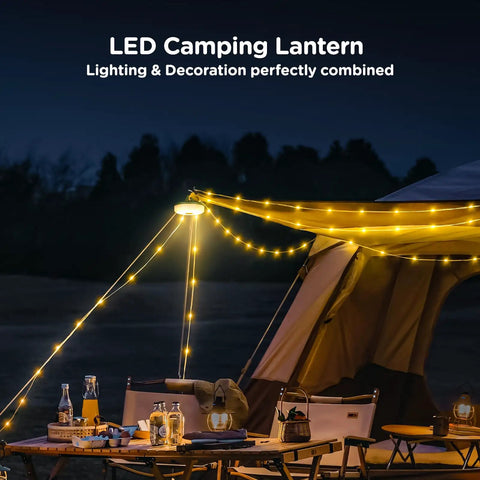 Camping String Lights 32.8 Ft Rechargeable 4 In 1 Quick Storage Tent Lights With 8 Lighting Modes Waterproof Portable LED Lamp hanging over a camping table.