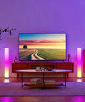 Lit RGBIC Color Changing Floor Lamp 2 Pack With WiFi App And Remote in a modern living room with TV and colorful glow