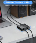 Active 2 Channel 3.5mm Audio Mixer for PC Console Phone and MP3 Players, shown on desk with cables connected, compact size.