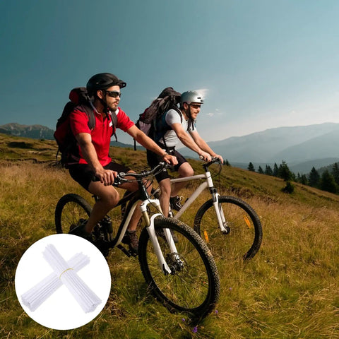 Cyclists with dirt bikes featuring White Spoke Covers 72 Pcs Universal 8 To 21 Inch Reflective Wheel Covers for decoration and protection.
