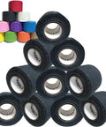 Professional Drumstick Grip Tape Pack Features Soft Cotton Gauze Wrap For Killer Stick Control And Lockdown Feel On Drums Hella Comfortable Percussion Gear Black Ten Bundle stacked rolls of black grip tape with colorful rolls behind.