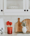 Kitchen with Ten Pack One And One Quarter Inch Oil Rubbed Bronze Cabinet Knobs on white cabinets, decorative items on counter