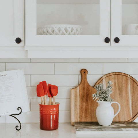 Kitchen with Ten Pack One And One Quarter Inch Oil Rubbed Bronze Cabinet Knobs on white cabinets, decorative items on counter