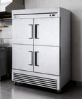 Top Shelf Heavy Duty Commercial Upright Freezer With Four Solid Doors And Slick Stainless Steel Construction 44.5 Cu Ft Reach In Rig For Restaurants Bars Or Garages Ice Cold Fan Cooling Setup in a kitchen setting.