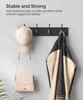 Black Finish Wall Mounted Coat Rack With Dual Metal Hooks Holds Coats Bags Keys In Entryway Bedroom Or Living Room 6.6 Lb Per Hook Load Capacity showing hats and coat