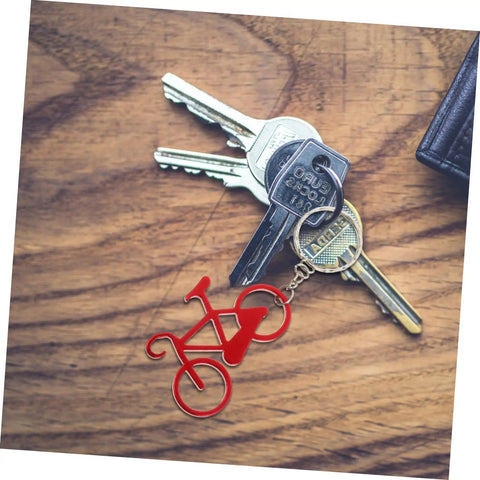 Everyday Carry Bottle Opener Keychain With Bicycle Pendant Multipurpose Lightweight Metal Lid Lifter For Bar And Car Keys Durable EDC Accessory Pack Of Ten on wooden table