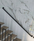 Massive Wrought Iron Stair Handrails That Hit Different With Rock Solid Build And Totally Adjustable One To Twenty Feet Span For Your Indoor Or Outdoor Staircase Project Plus This Heavy Duty Metal Bannister Brings Top Shelf Quality To Your Balcony And with black railing installed on a modern staircase.