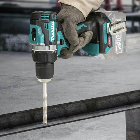 40V Max Xgt Compact Brushless Cordless 1/2 Drive Impact Wrench in use with drill bit on metal surface.