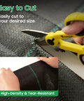 Yellow scissors cutting Heavy Duty Weed Barrier Landscape Fabric Made From 100 Percent New Polypropylene Black 3 Foot By 100 Foot Water Permeable Tear Resistant For Gardening Tough As Nails Built To Last And Keeps Weeds Out.